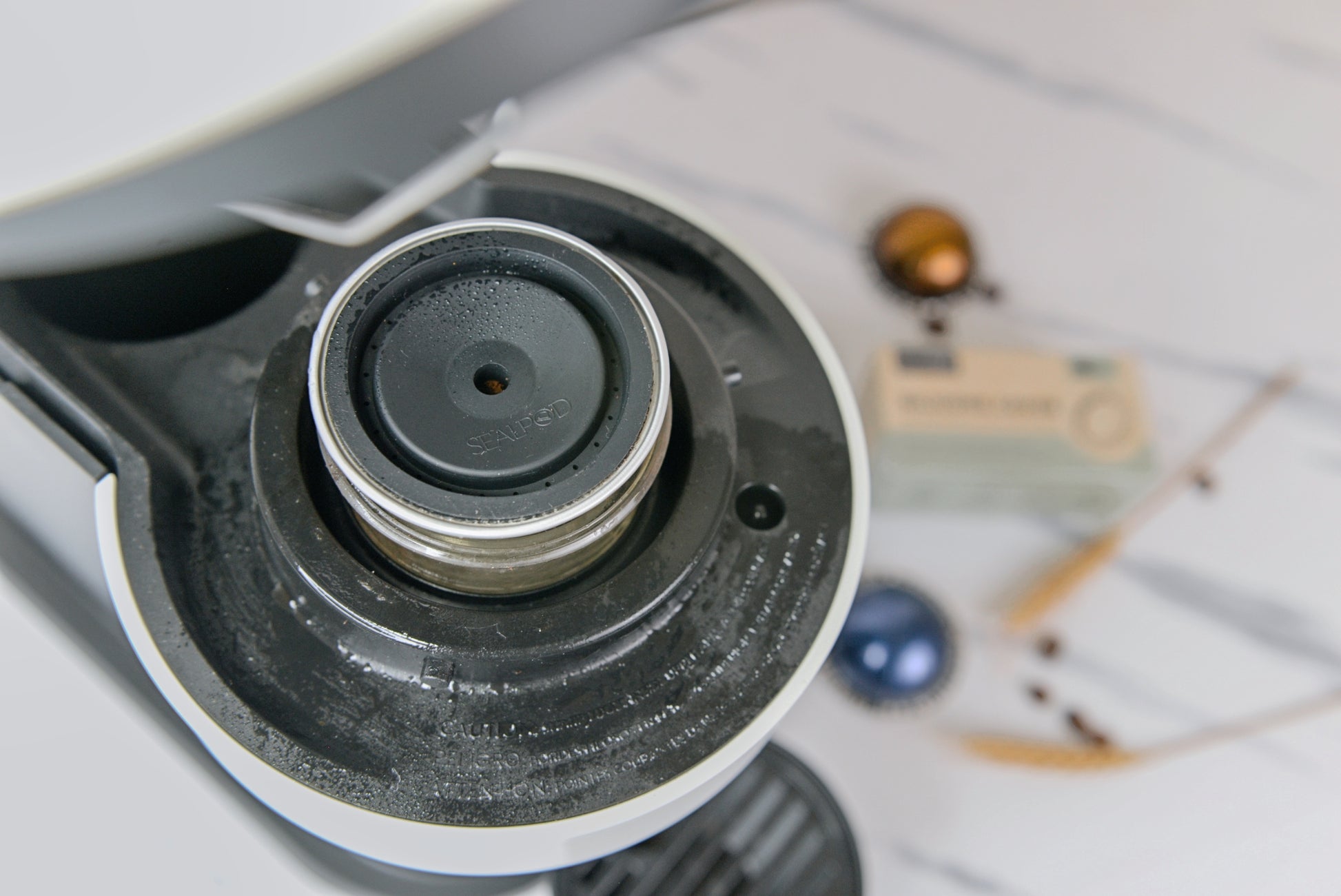Sealpod reusable Vertuo lid in use with a Nespresso Vertuo machine